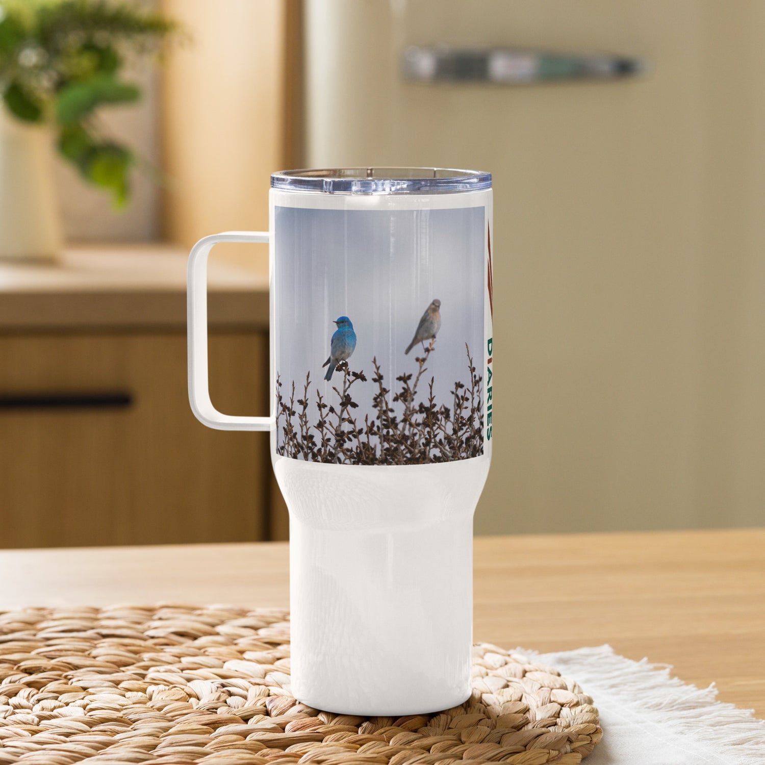 Mountain Bluebirds Travel mug with a handle